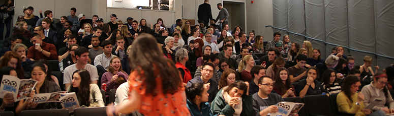 Full crowd of students at a film screening