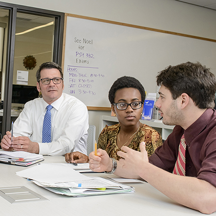 A student talks to staff members in the ARC