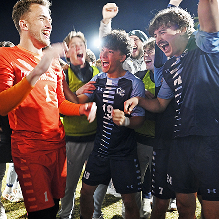 Members of the mens soccer team celebrate their NCAA semifinal victory.